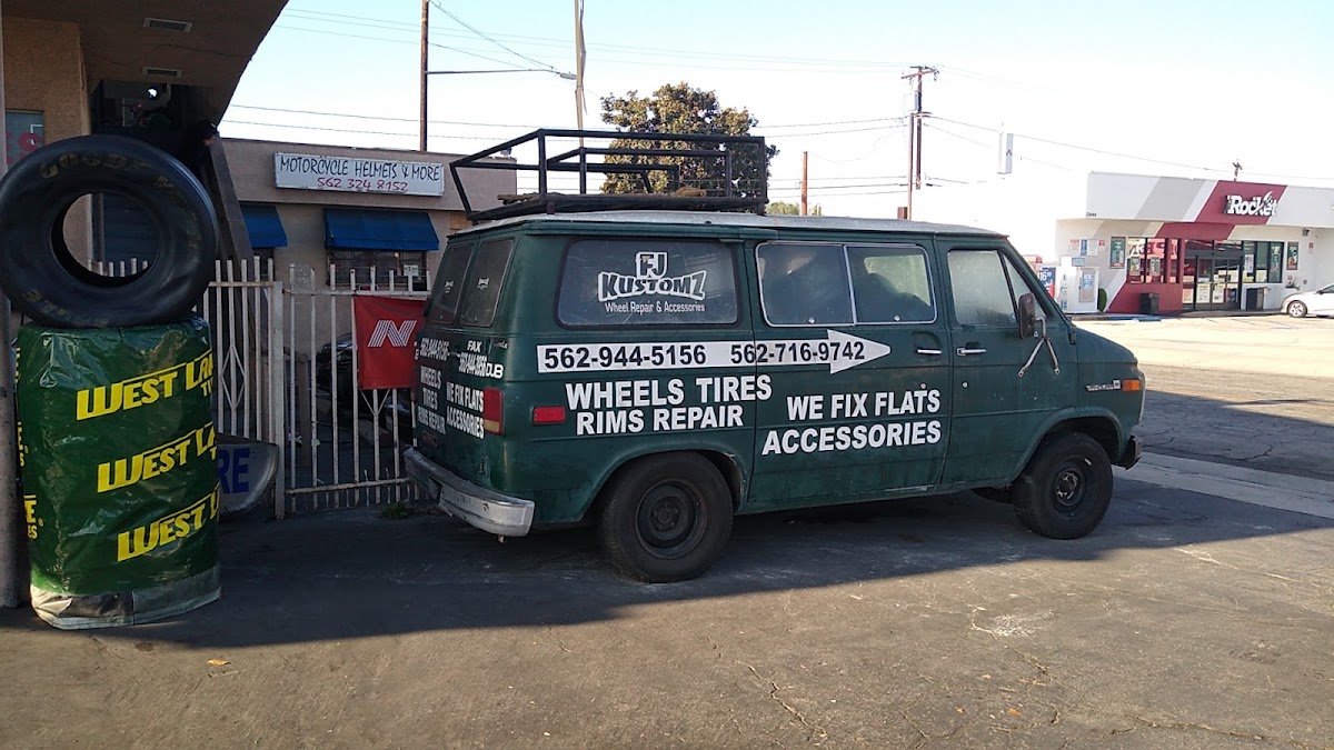 The Rivas shop van parked outside, with the used tire sign above it